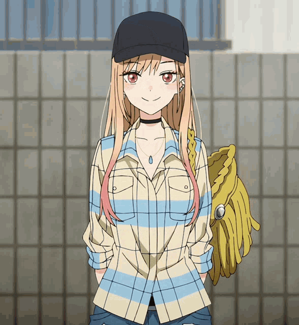 a girl wearing a plaid shirt and a baseball cap is holding a yellow glove