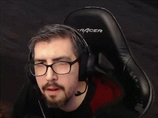 a man with glasses and a beard is wearing headphones and a headset .