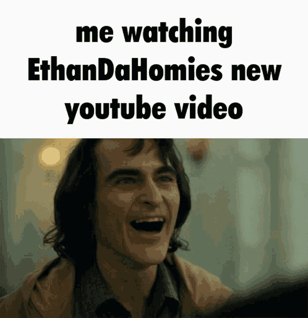 a man is laughing with the words me watching ethandahomies new youtube video below him