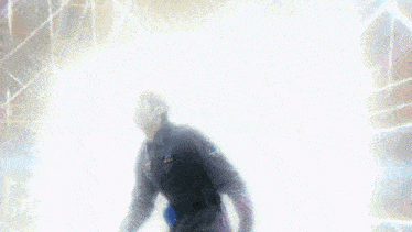 a blurry image of a person walking in a dark room