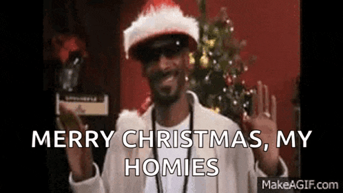 snoop dogg is wearing a santa hat and sunglasses and says merry christmas to his homies .