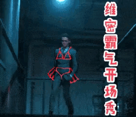 a man in a suit is dancing in front of a sign that says ' chinese ' on it