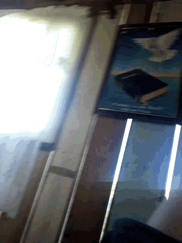 a book is sitting on a table in front of a light