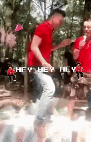 a man in a red shirt is dancing with the words hey hey hey in the background