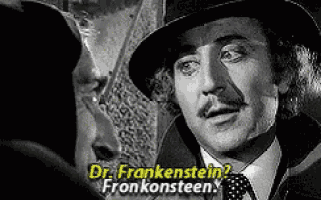 a man in a hat is talking to another man .