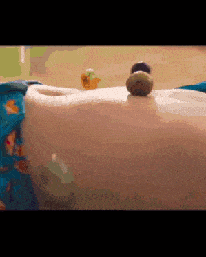 a close up of a person 's torso with a few toys on it