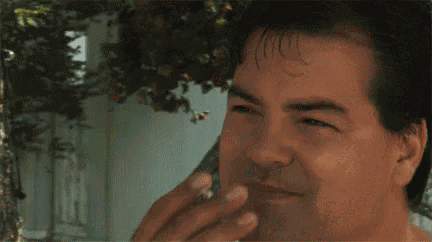 a man smoking a cigarette with the words all i really want is to get high and mow lawns