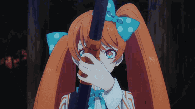 a girl with orange hair and a blue bow is covering her face