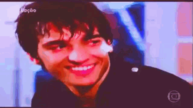 a close up of a man 's face on a television screen .