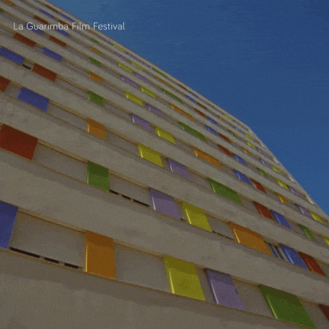 looking up at a tall building with la guarimba film festival written on the top
