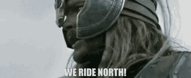 a close up of a man wearing a helmet and armor .