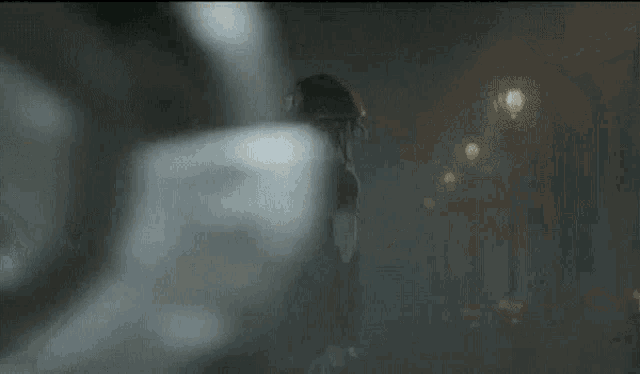 a close up of a person 's face with a shadow on it