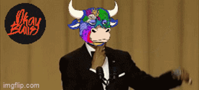a picture of a man in a tuxedo with a bull mask on his face