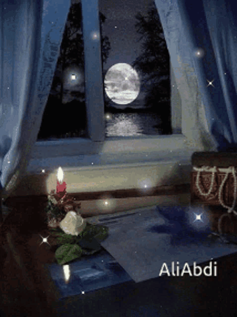 a candle sits on a table in front of a window with the name aliabdi on the bottom