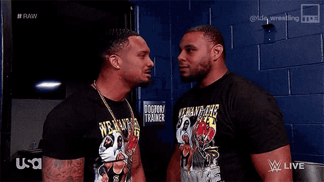 two men are standing next to each other and one of them is saying we want the smoke