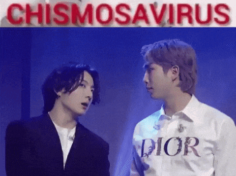 a couple of men standing next to each other on a stage .