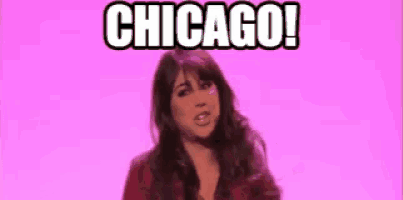 a woman is standing in front of a pink background with the words `` chicago '' on it .