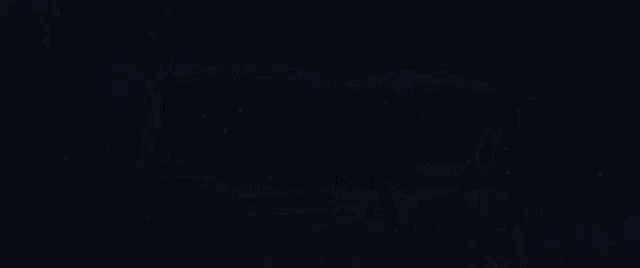 a blurry picture of a city at night with a lot of lights .