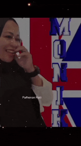 a woman is standing in front of a british flag with the words " lalat jatuh ke dalam air putih maka airnya dibui "