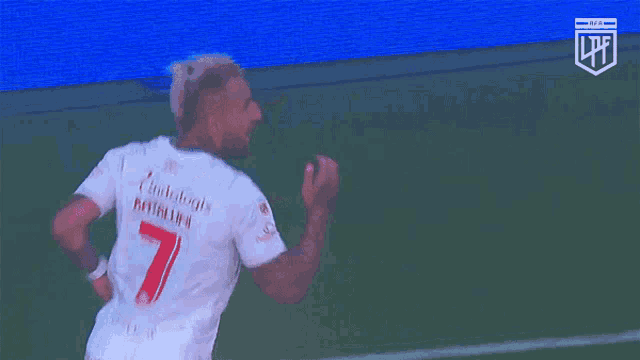 a soccer player wearing a white shirt that says lfl on it