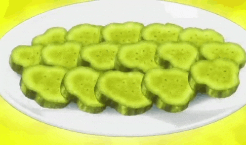 a plate of cucumber slices on a yellow background .