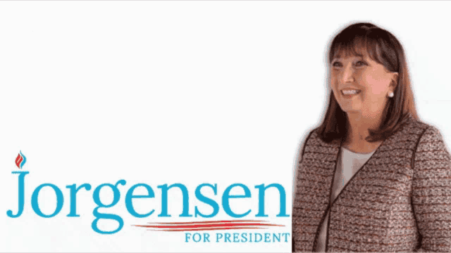 a woman stands in front of a sign that says " now is the time she is the one you are the power jorgensen for president "