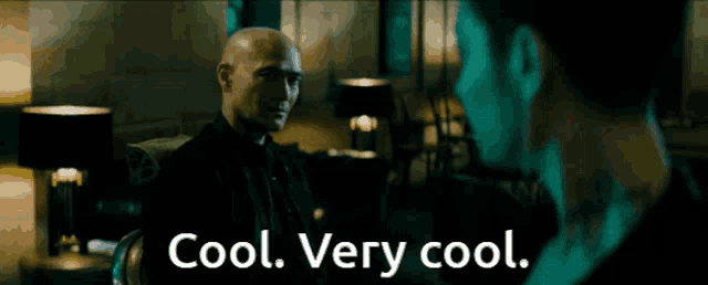 a man talking to another man with the words cool very cool below him