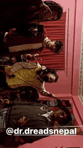 a group of people are standing in a room with the name dr.dreadsnepal written on the bottom