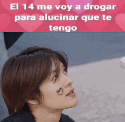 a woman with a tattoo of a heart on her face and the words el 14 me voy a drogar para alucinar que te tengo