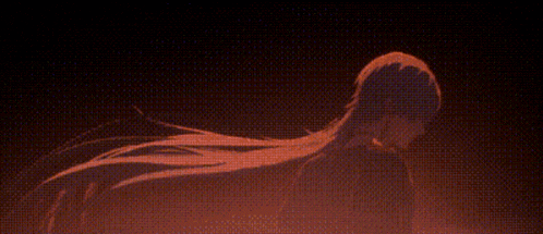 a close up of a person 's face with a sword in the background .