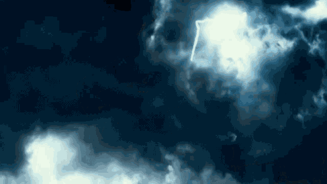 a lightning bolt is shining through the clouds in a dark sky