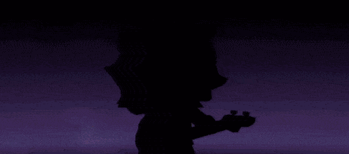 a person is standing in the dark with a light coming out of their head