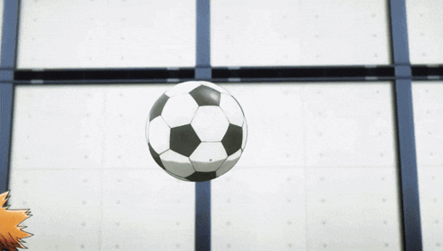 a soccer ball is being kicked in the air