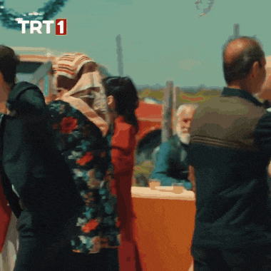 a group of people are standing in front of a trt1 logo