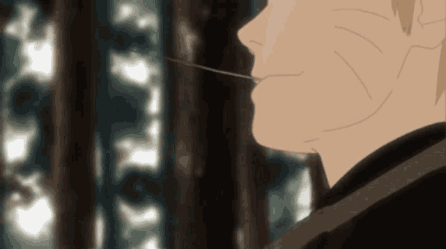 a close up of a person 's face with a blurred background