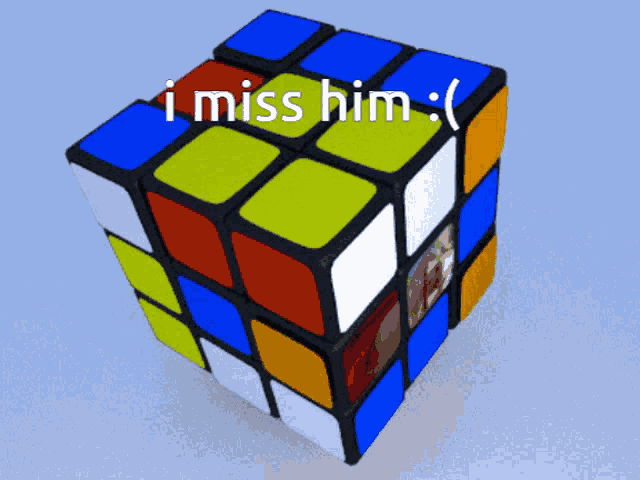 a colorful rubik 's cube with the words i miss him on it
