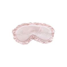 a pink sleep mask with a ruffled border on a white background .