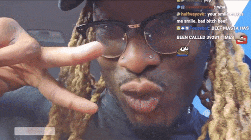 a man wearing glasses has been called 39281 times on the screen behind him