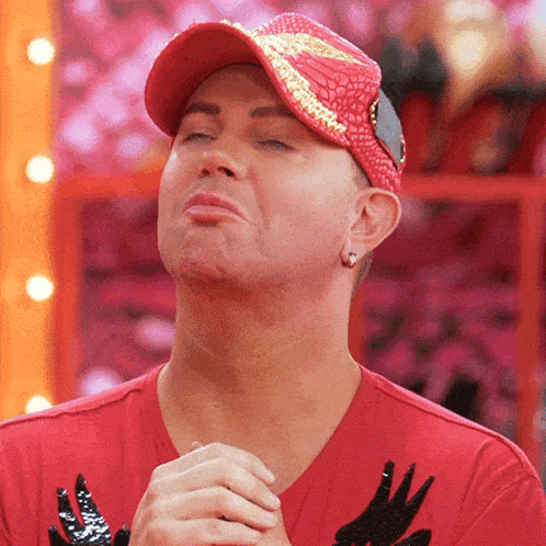 a man wearing a red shirt and a red hat