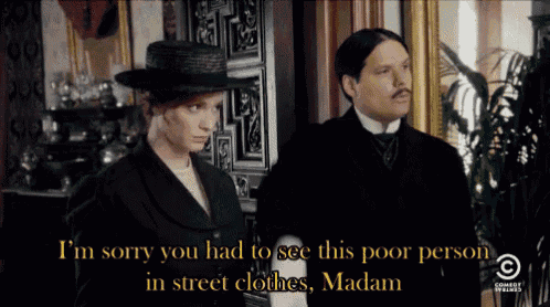 a man and a woman are standing next to each other and the man says i 'm sorry
