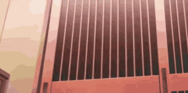 a close up of a red door with a lot of bars on it .