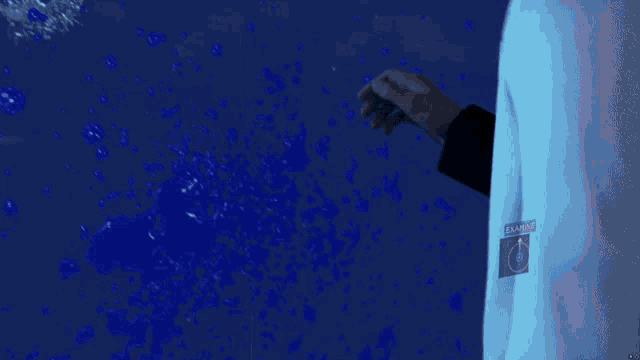 a close up of a man 's face with a blue light on his neck