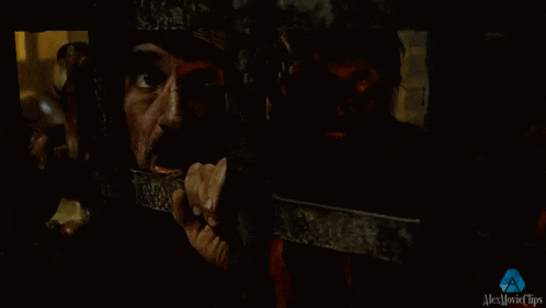 a man is peeking through a fence with alex movie clips written on the bottom