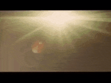 a close up of a light shining through a window .