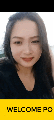 a woman 's face is on a yellow sign that says " welcome po "