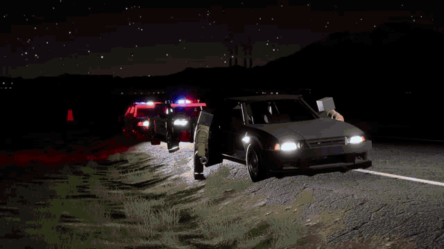 a couple of police cars are driving down a road