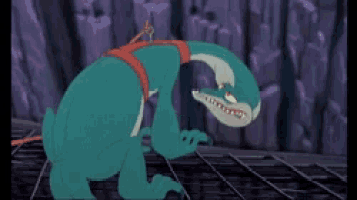 a blue cartoon character with a red belt around his waist