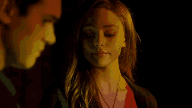 a man and a woman are standing next to each other