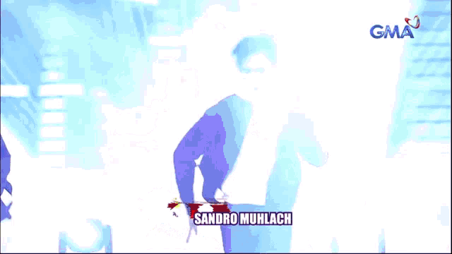 a man is dancing on a stage with the name sandro muhlach written on the bottom