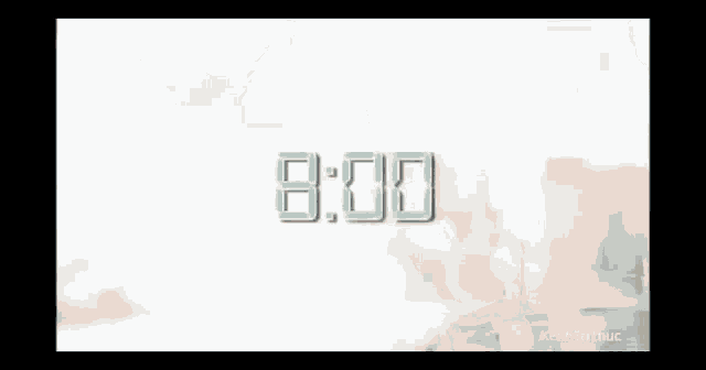 a blurred image of a city with a few buildings in the background .